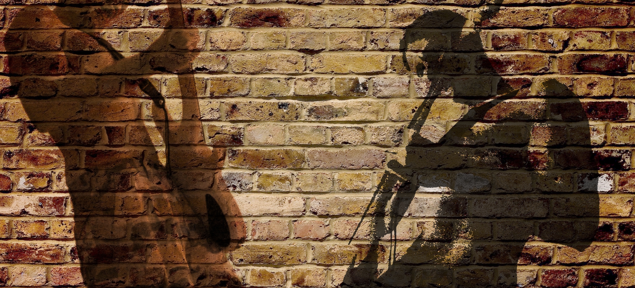 The wide shot behind the logo. Brick, a wall of guitars, a bench mid-session — something with room in the middle, because the mark sits over it.